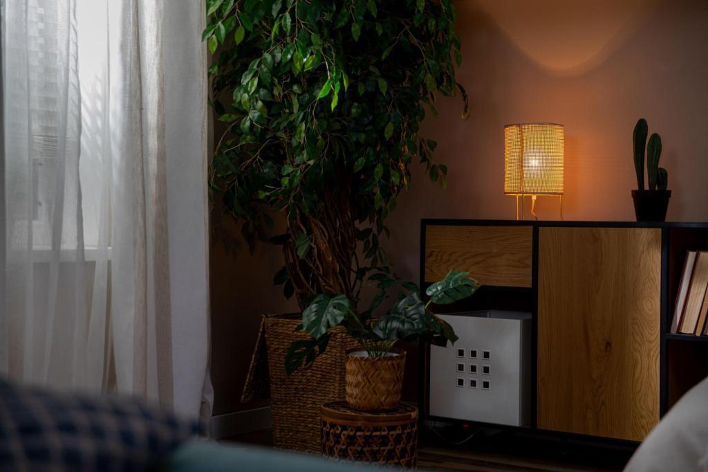 A warm, softly lit bedroom with cozy textures and a peaceful atmosphere.